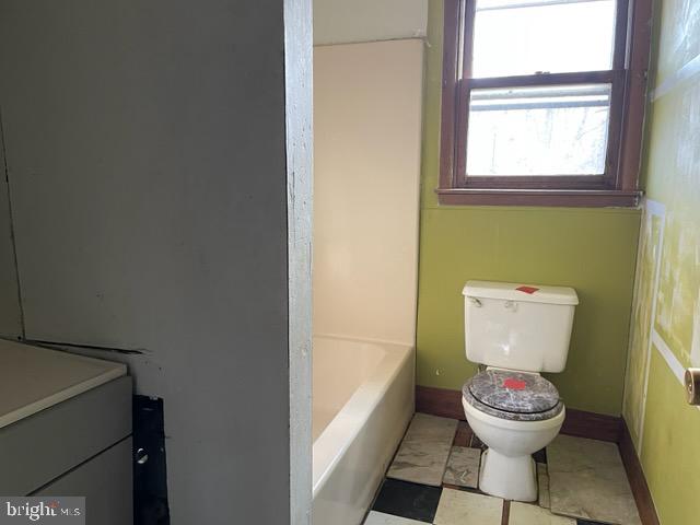 626 Cloverfield Lane Harrington, DE 19952 - Photo 13 of 13 a bathroom with a toilet sink and a window