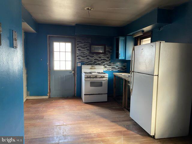 626 Cloverfield Lane Harrington, DE 19952 - Photo 5 of 13 a kitchen with stainless steel appliances granite countertop a refrigerator a stove a sink and a microwave