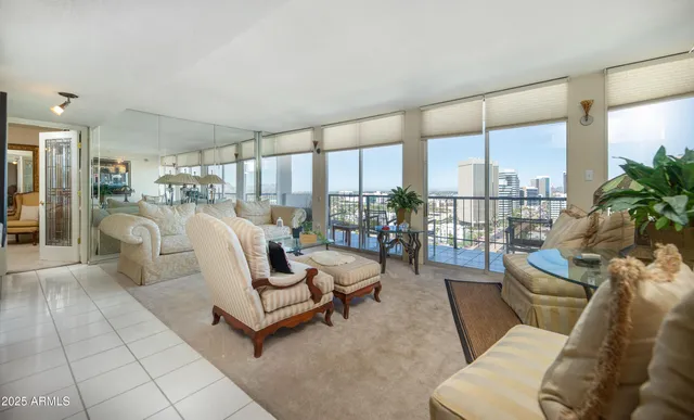a bedroom with a bed and large window