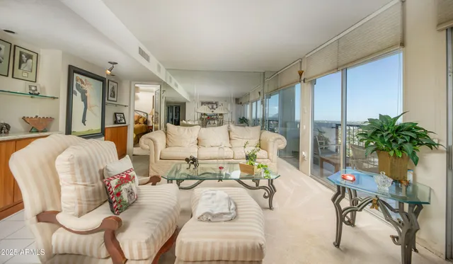 a bedroom with a bed and a flat tv screen