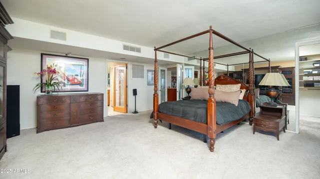 a bathroom with double vanity sinks and a shower