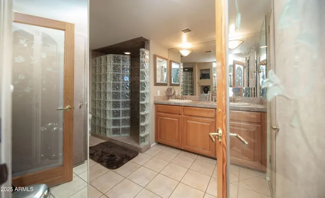 a view of a hallway with a door and stairs
