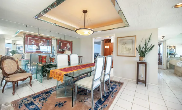 a very nice looking living room with furniture and a chandelier