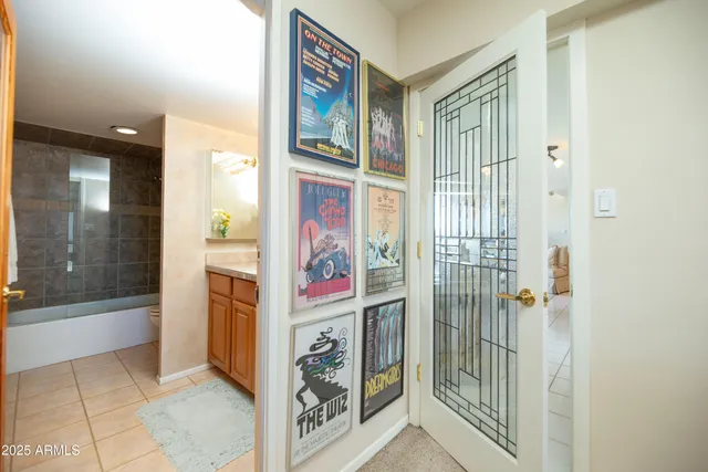 a view of a patio with a table and chairs under an umbrella
