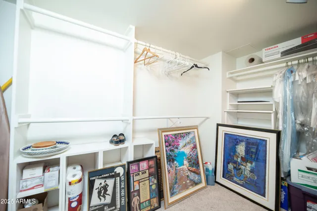 a view of a patio with a table and chairs under an umbrella