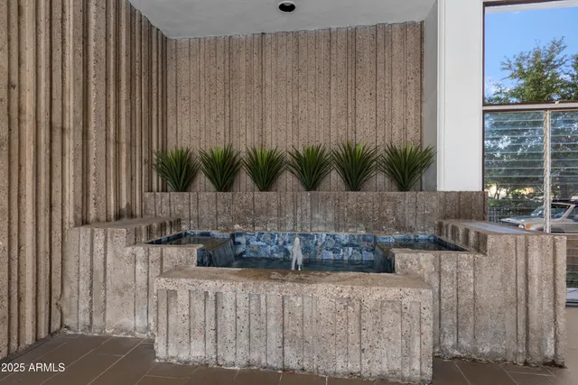 a view of a swimming pool with a patio and a yard