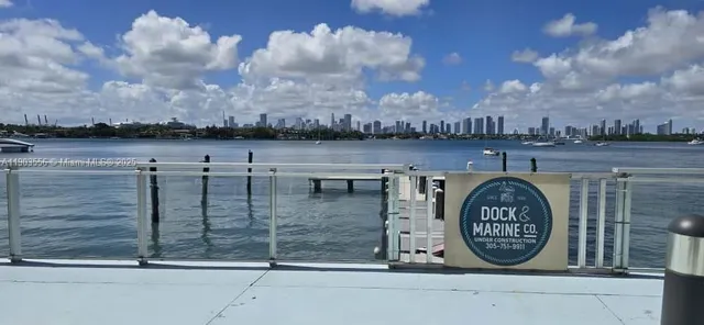 a view of a wooden deck with lake view