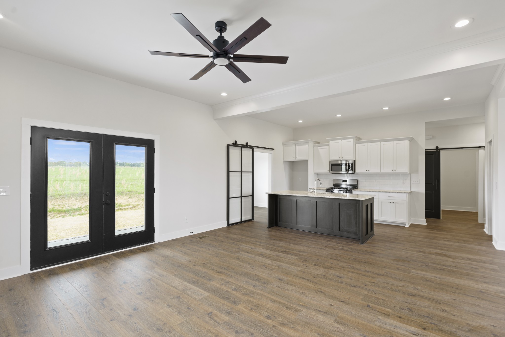 3368 Calista Road White House, TN 37188 - Photo 13 of 37 a view of kitchen with kitchen island wooden floor center island and stainless steel appliances