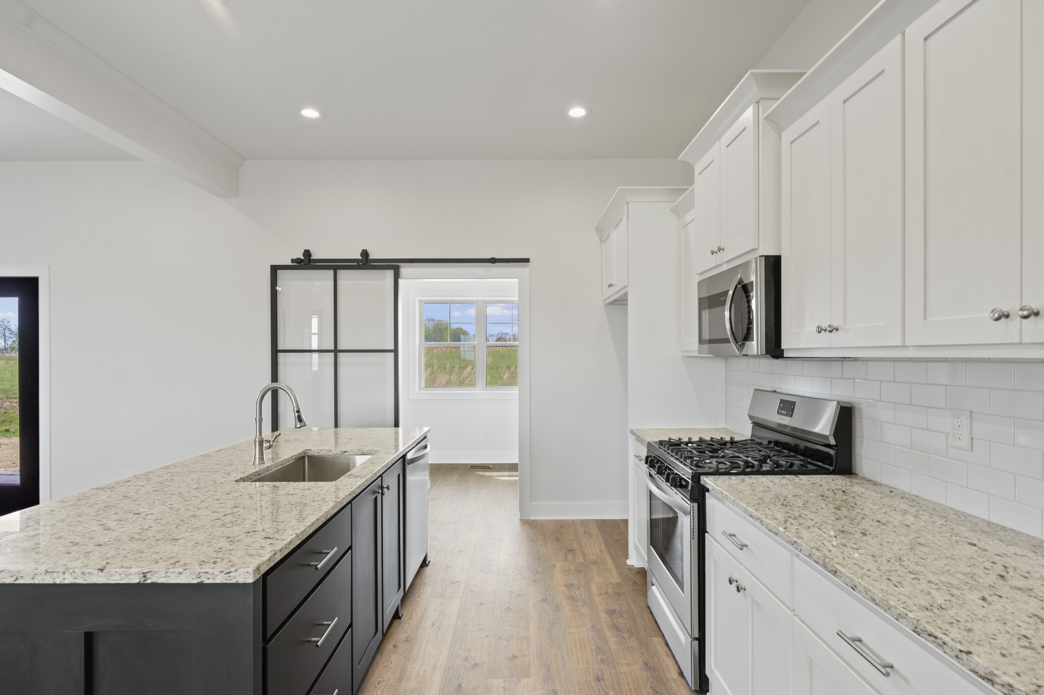3368 Calista Road White House, TN 37188 - Photo 15 of 37 a kitchen with stainless steel appliances granite countertop a sink stove and cabinets