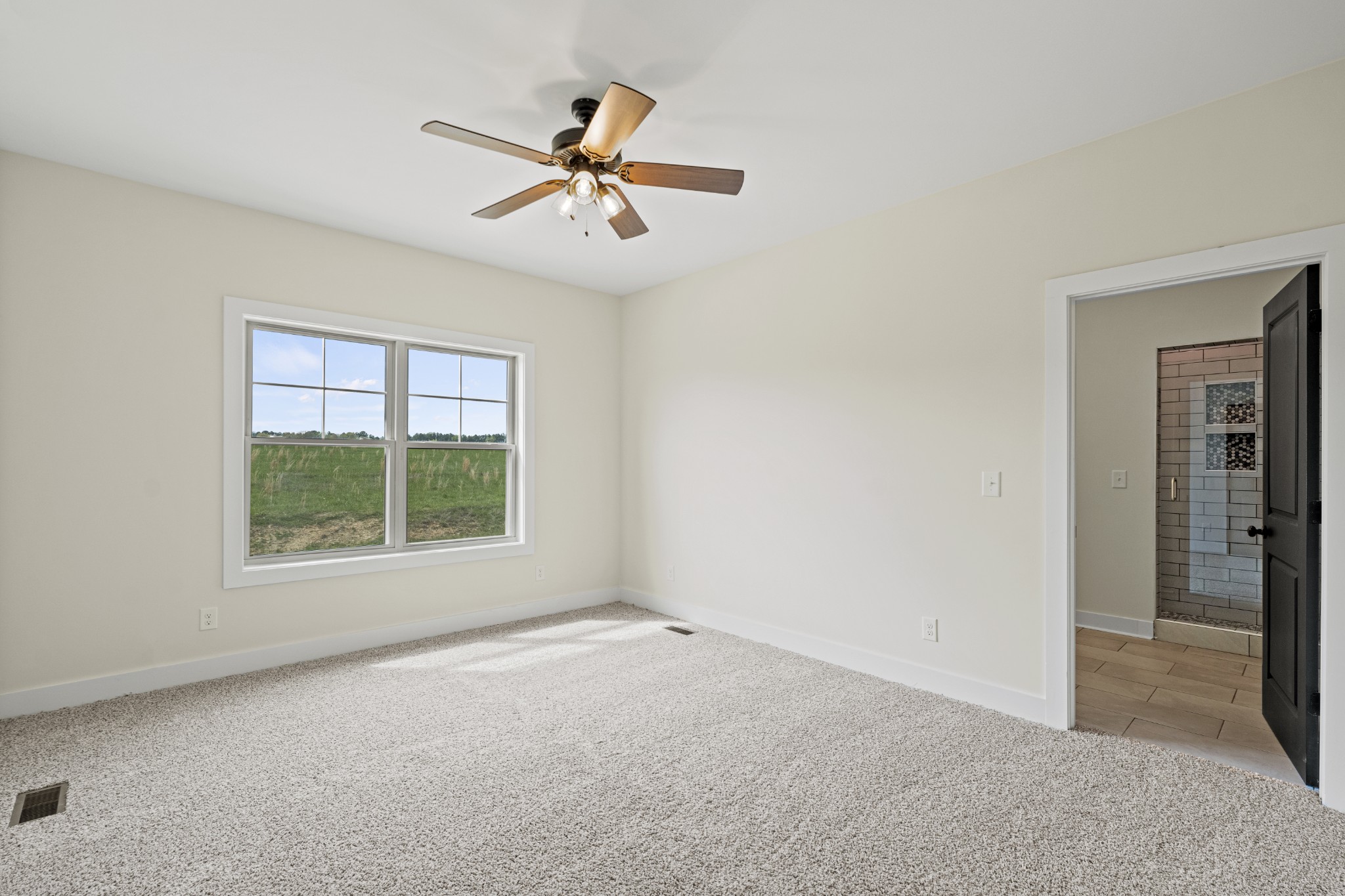 3368 Calista Road White House, TN 37188 - Photo 19 of 37 an empty room with windows and fan