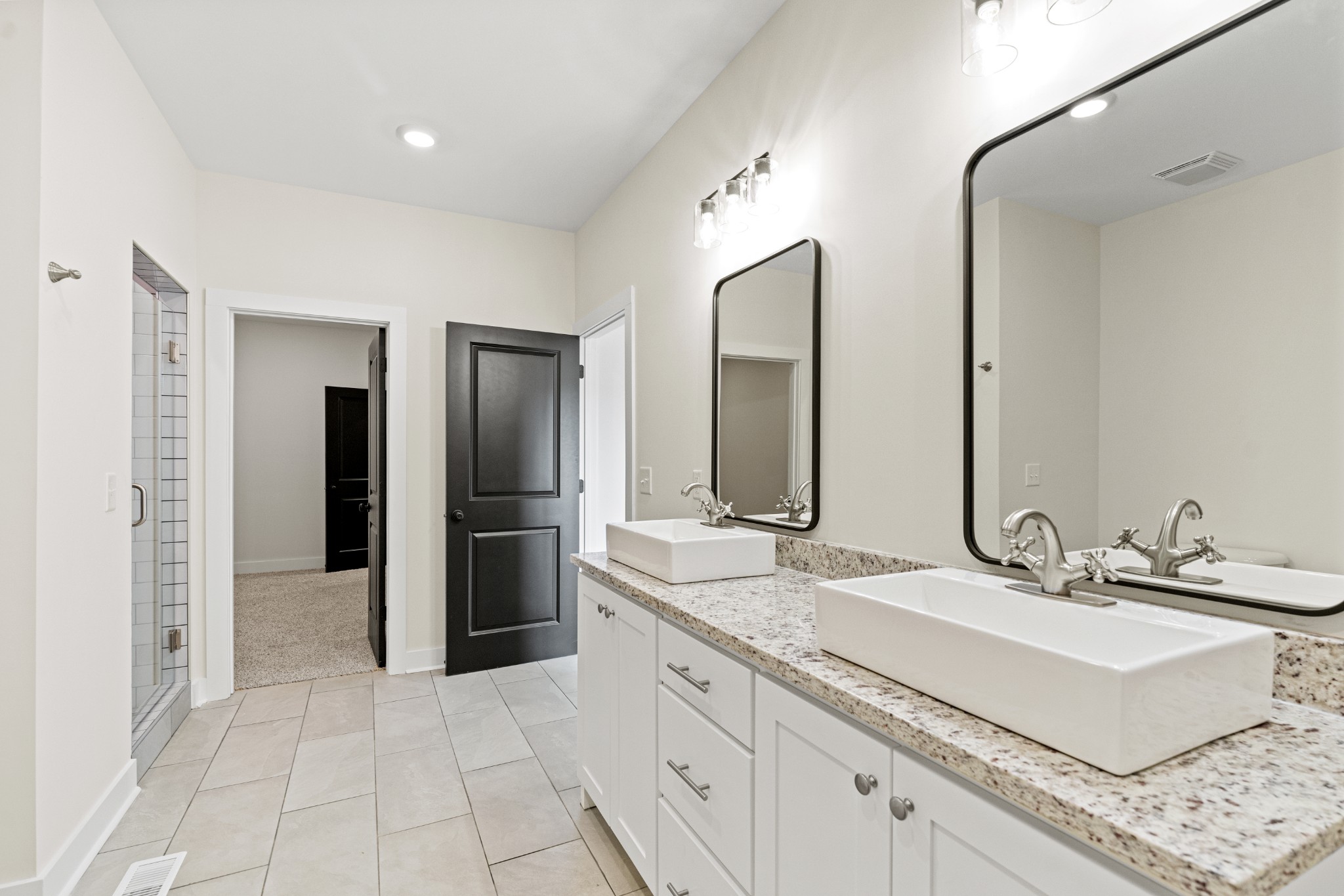 3368 Calista Road White House, TN 37188 - Photo 22 of 37 a bathroom with a double vanity sink and a mirror