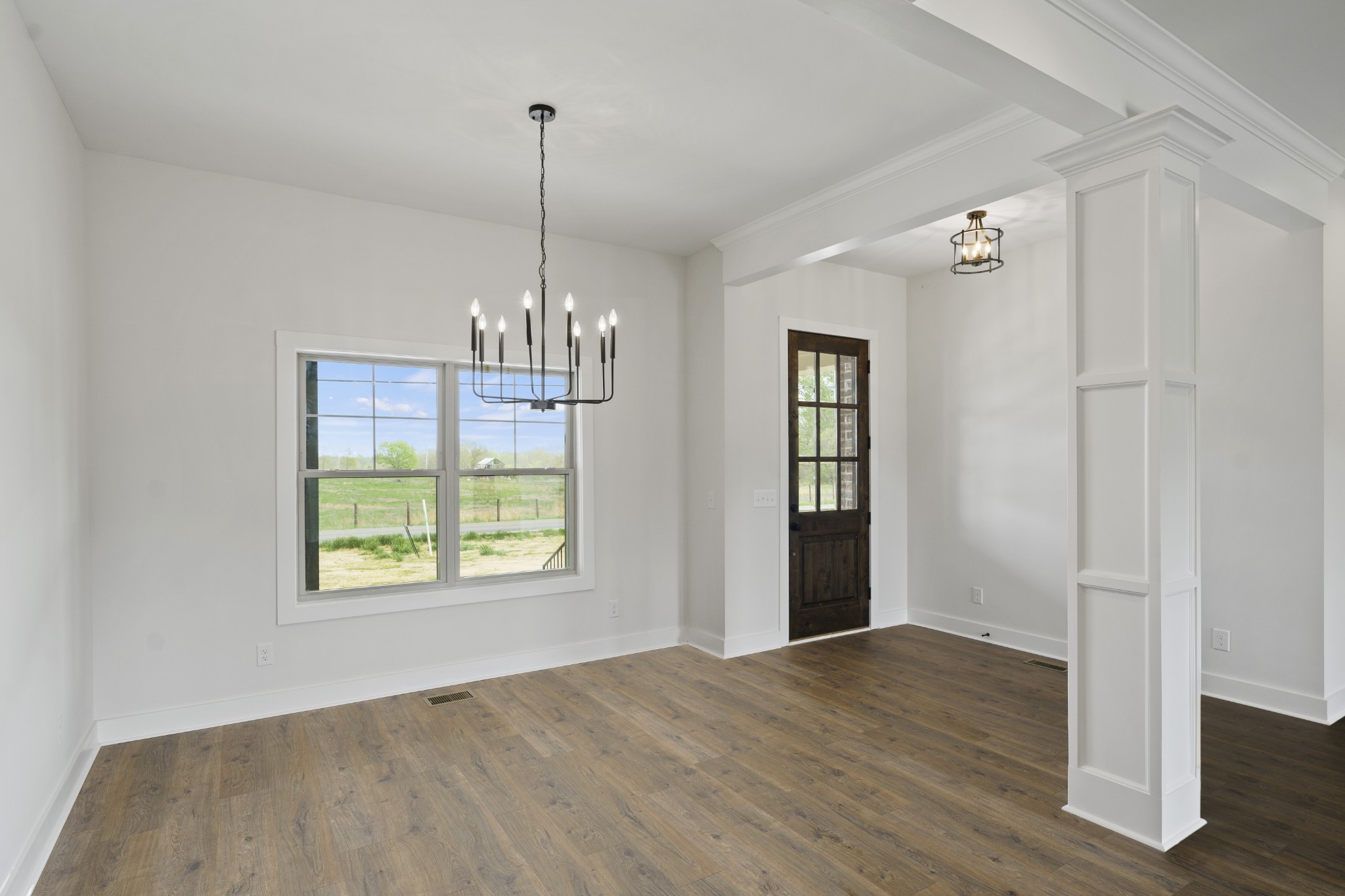 3368 Calista Road White House, TN 37188 - Photo 6 of 37 a view of an empty room with wooden floor and windows
