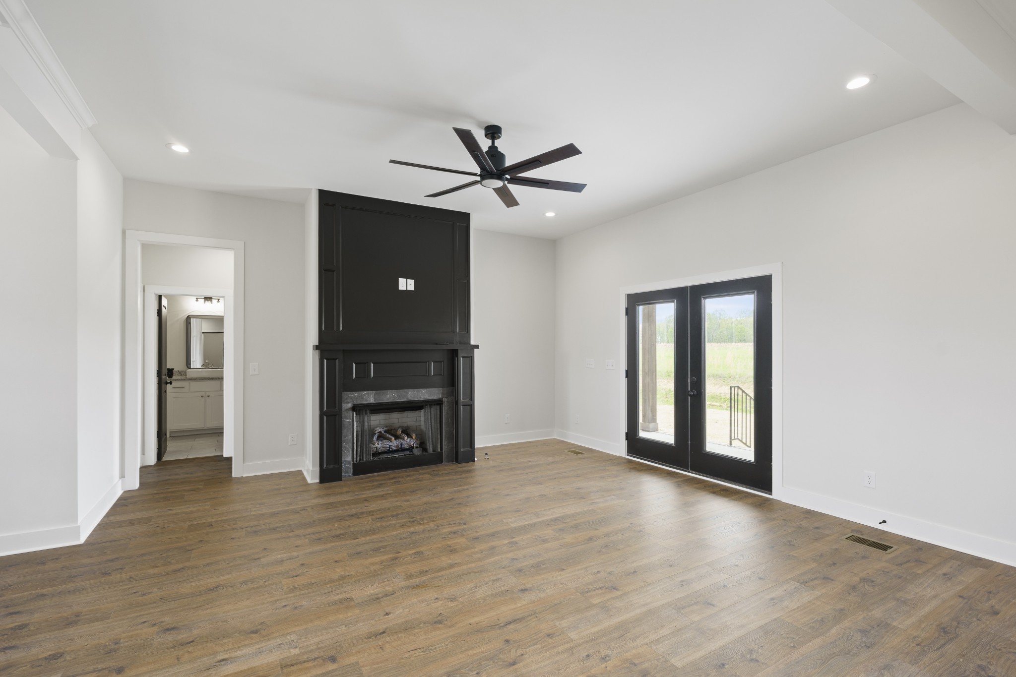 3368 Calista Road White House, TN 37188 - Photo 8 of 37 a view of a livingroom with a flat screen tv and a fireplace