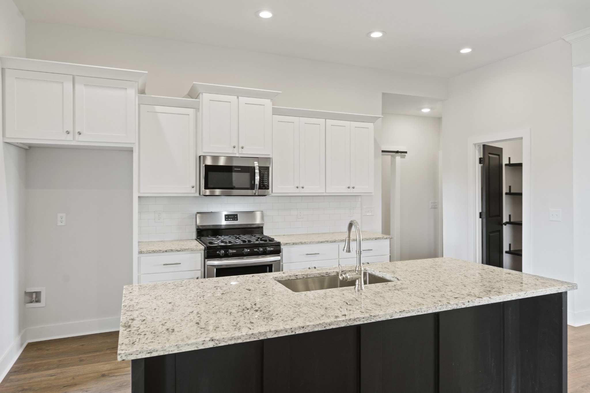 3368 Calista Road White House, TN 37188 - Photo 10 of 37 a kitchen with stainless steel appliances granite countertop a sink stove and refrigerator
