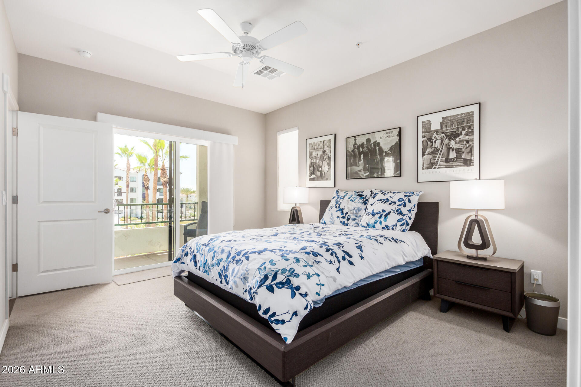 2511 West Queen Creek Road, Unit 258 Chandler, AZ 85248 - Photo 13 of 28 a bedroom with a bed and a chandelier