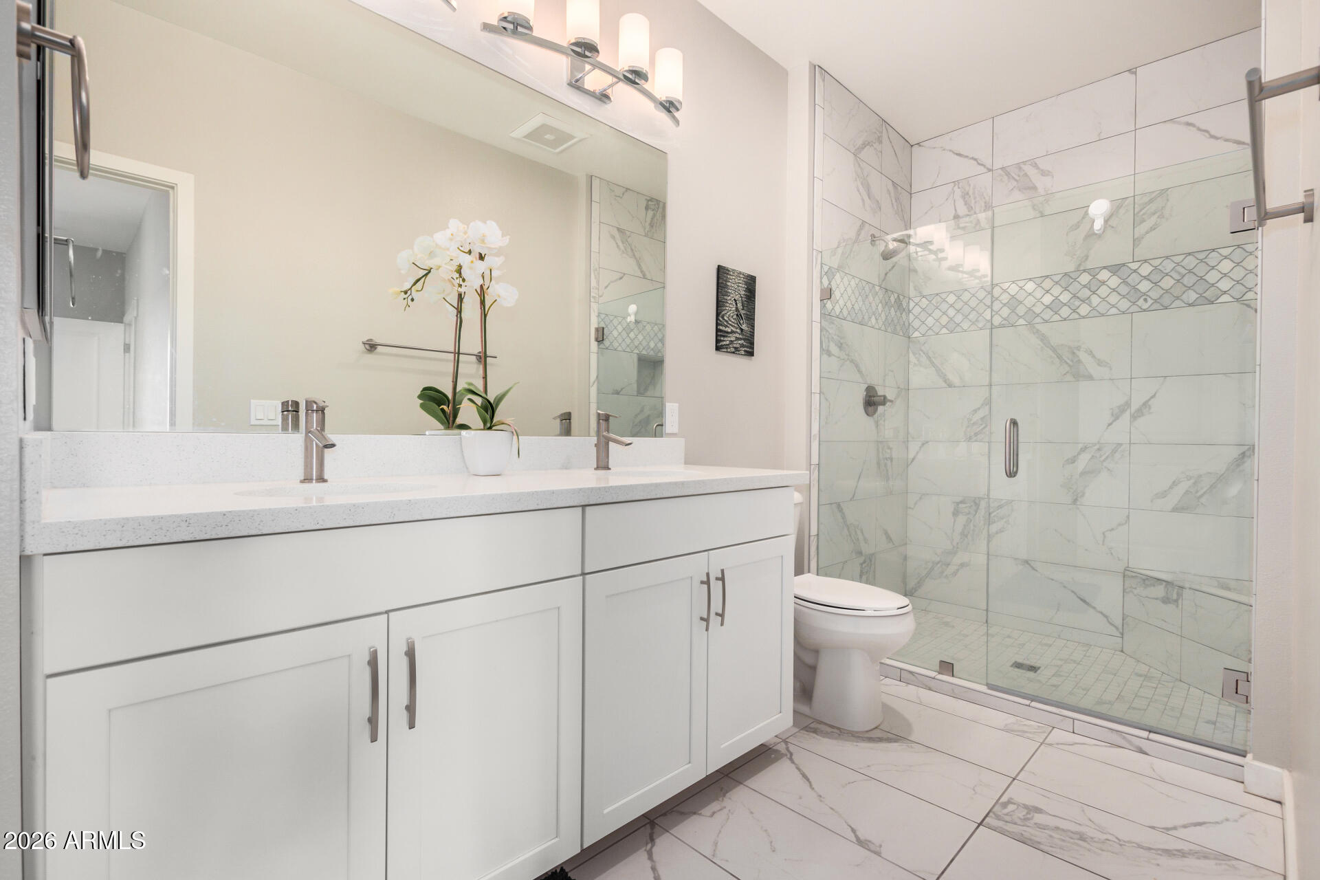 2511 West Queen Creek Road, Unit 258 Chandler, AZ 85248 - Photo 14 of 28 a bathroom with a double vanity sink toilet and shower