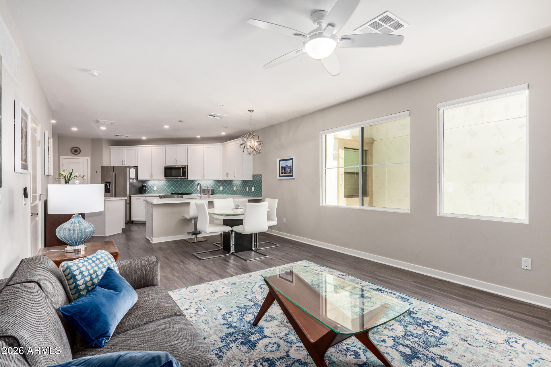 2511 West Queen Creek Road, Unit 258 Chandler, AZ 85248 - Photo 22 of 28 a living room with furniture and kitchen view