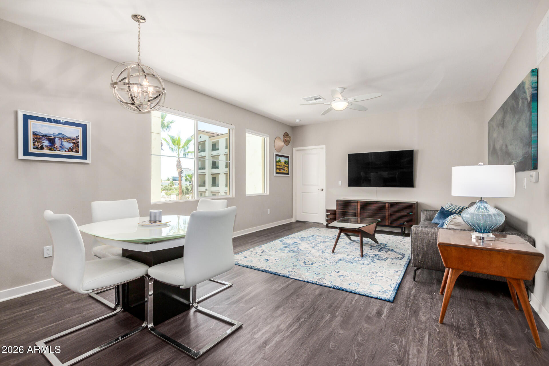 2511 West Queen Creek Road, Unit 258 Chandler, AZ 85248 - Photo 23 of 28 a living room with furniture a flat screen tv and a window