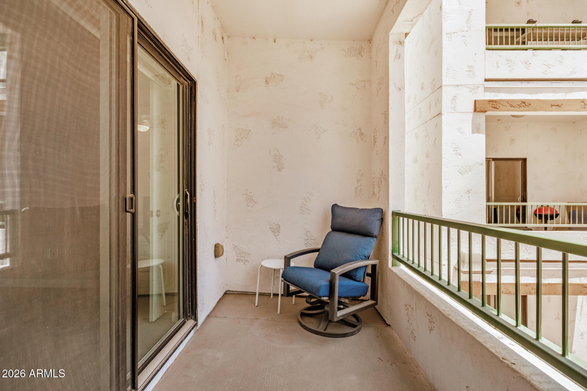 2511 West Queen Creek Road, Unit 258 Chandler, AZ 85248 - Photo 26 of 28 a view of a balcony with chair and next to a door