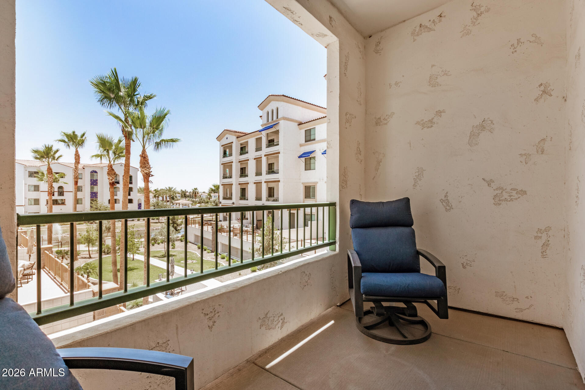2511 West Queen Creek Road, Unit 258 Chandler, AZ 85248 - Photo 27 of 28 a view of a chair and table in the balcony