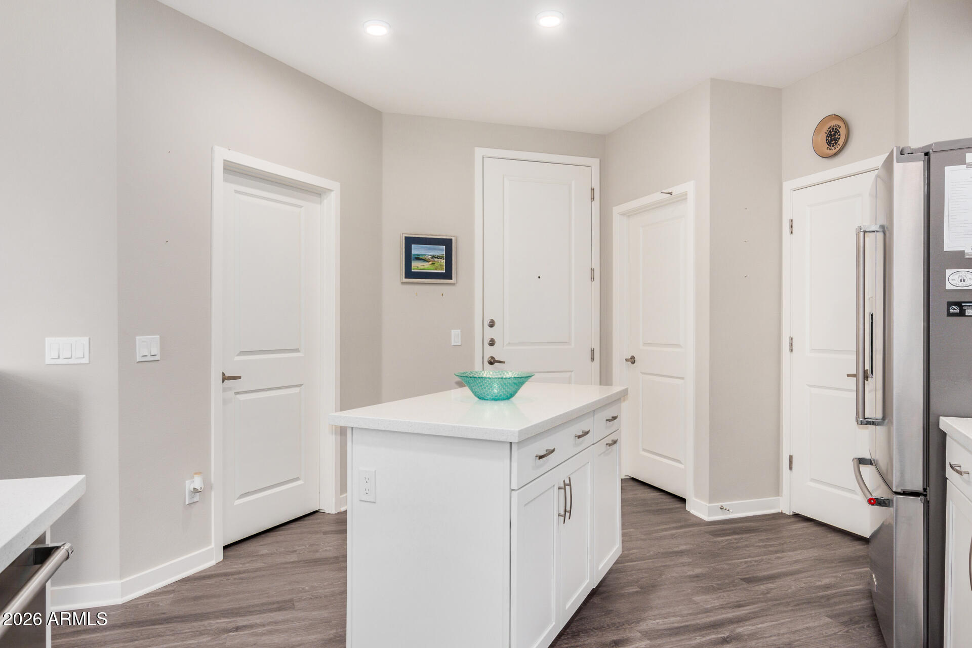 2511 West Queen Creek Road, Unit 258 Chandler, AZ 85248 - Photo 5 of 28 a kitchen with a stove top oven and a refrigerator