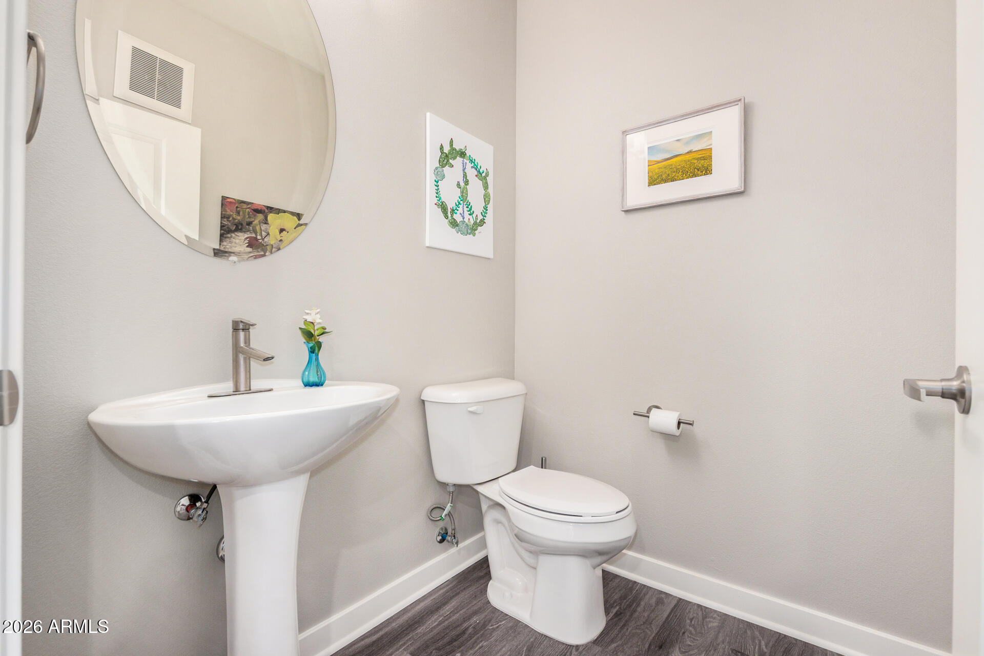 2511 West Queen Creek Road, Unit 258 Chandler, AZ 85248 - Photo 9 of 28 a bathroom with a sink mirror and toilet