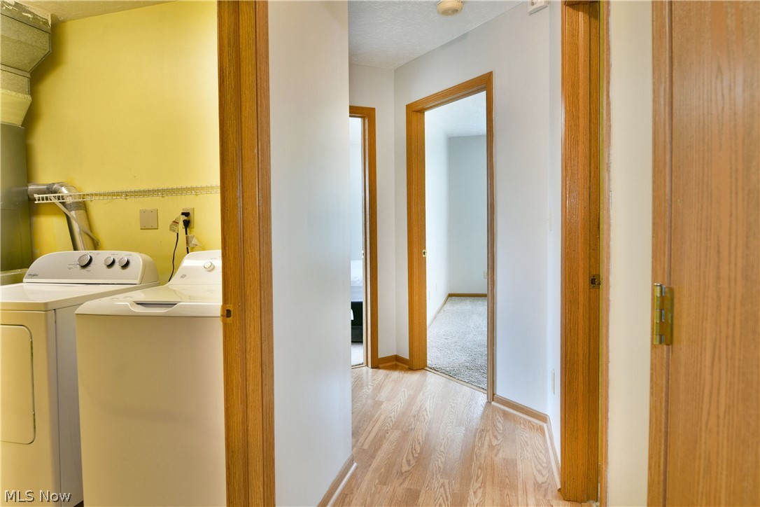 3287 Pheasant Run Road, Unit B Cortland, OH 44410 - Photo 32 of 45 Hallway with wood-finish flooring and multiple doorways