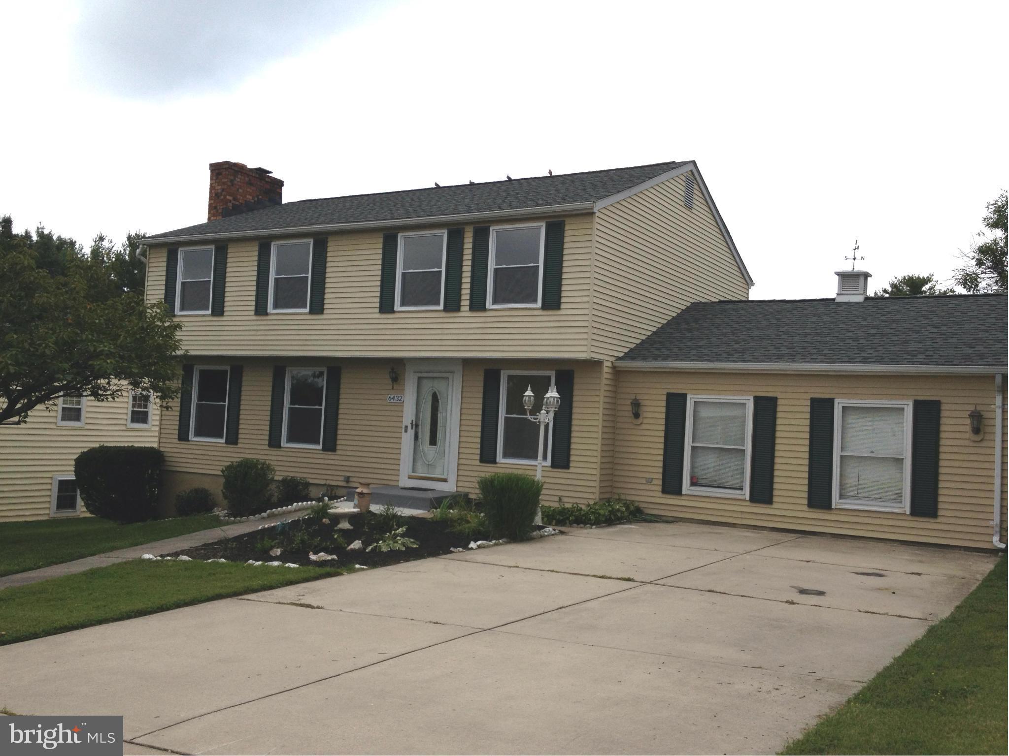 6432 St Phillips Road Linthicum, MD 21090 - Photo 2 of 27 a front view of a house with a yard