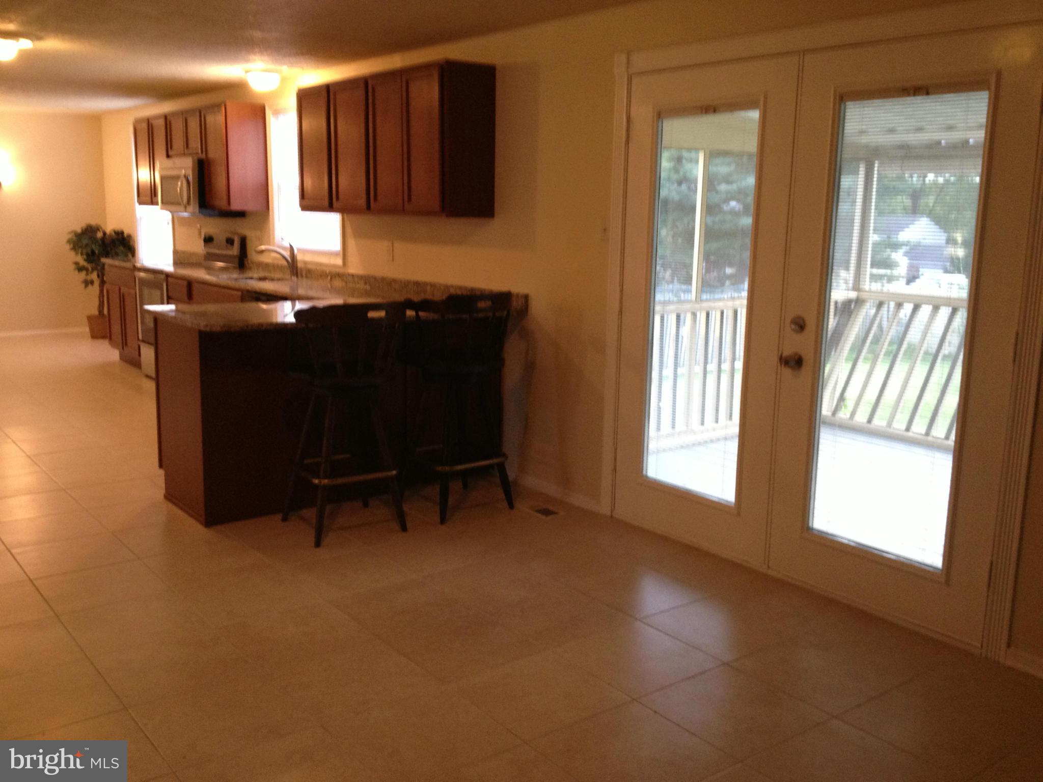 6432 St Phillips Road Linthicum, MD 21090 - Photo 12 of 27 a view of kitchen with furniture and window