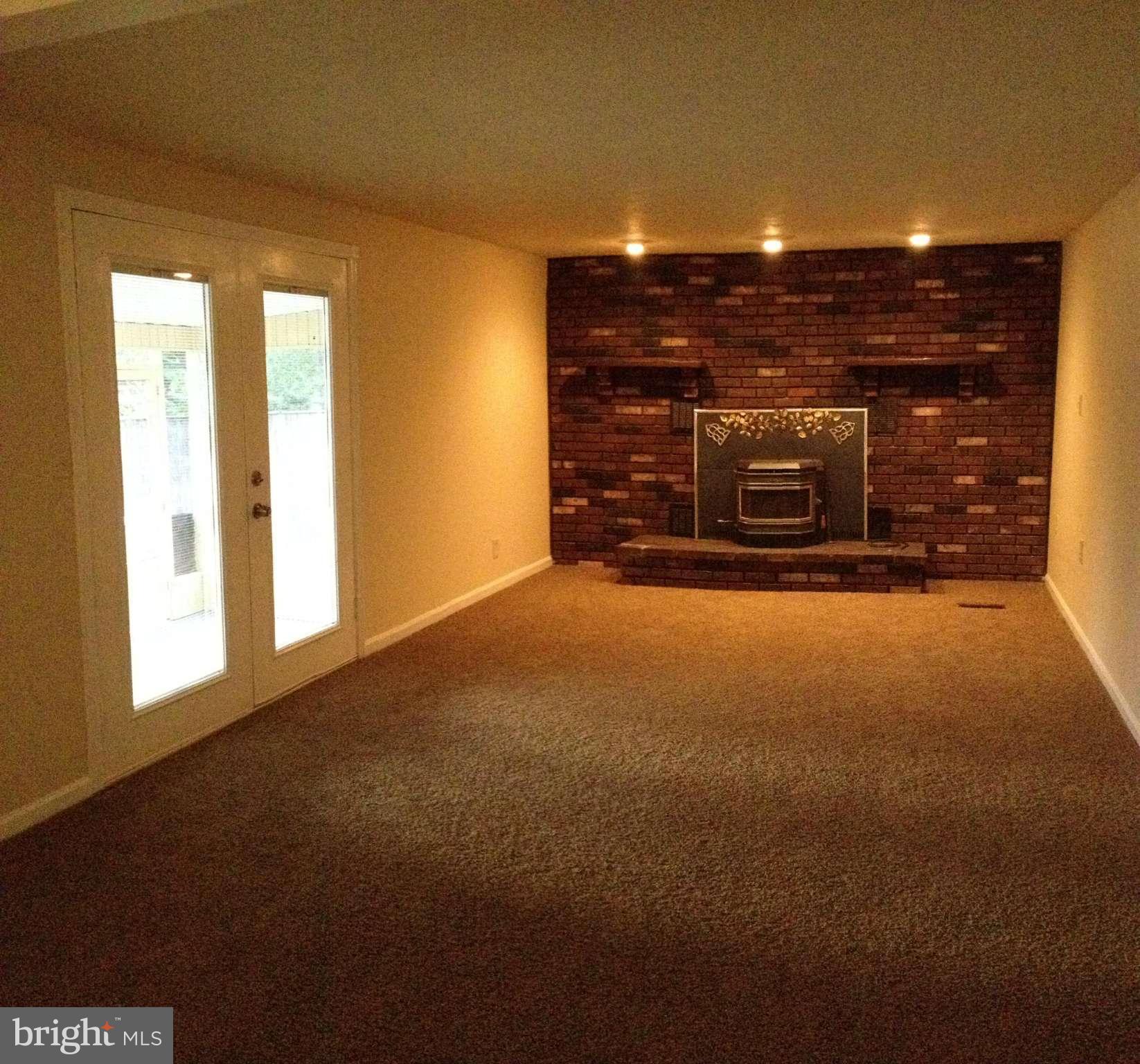 6432 St Phillips Road Linthicum, MD 21090 - Photo 13 of 27 a view of an empty room with a fireplace