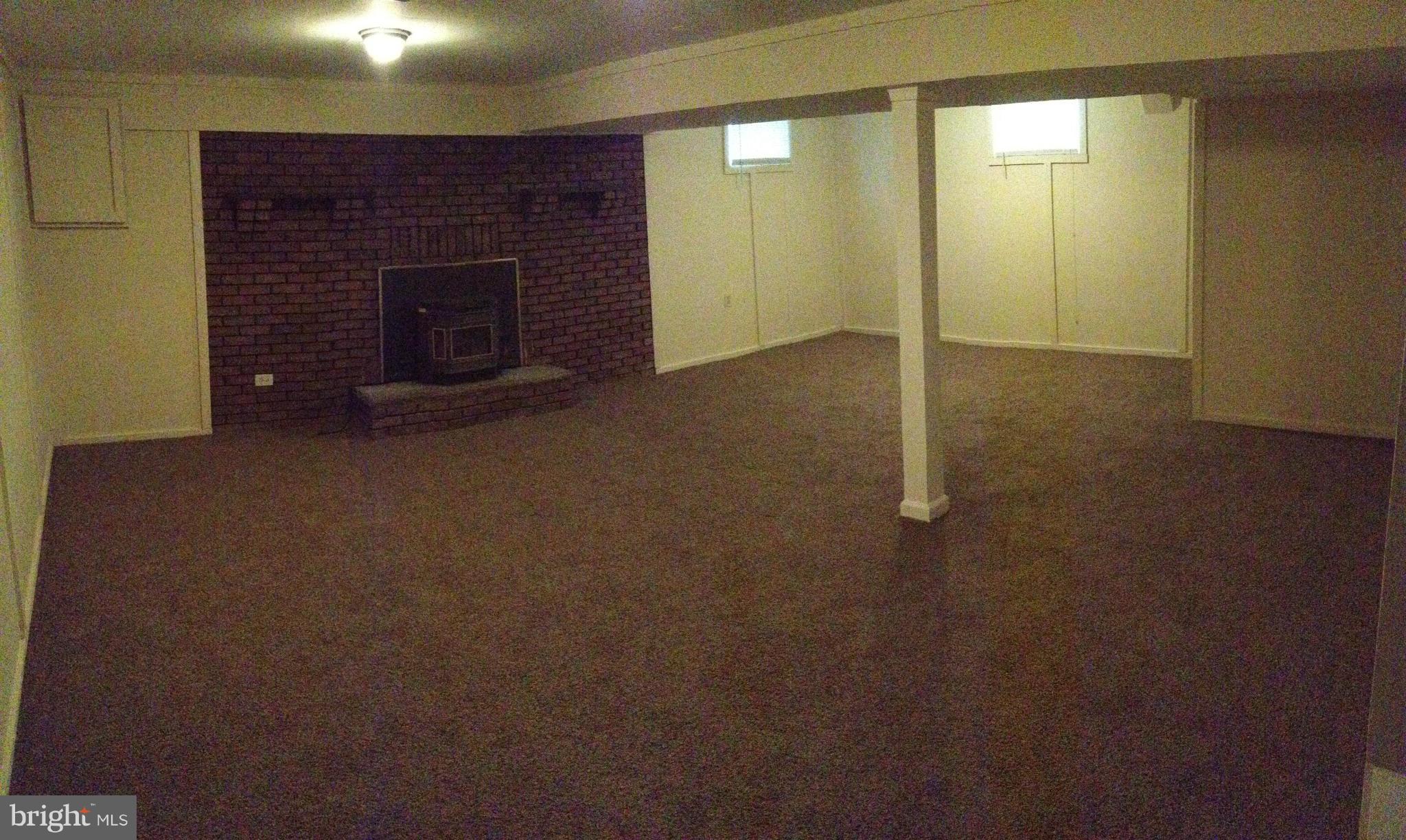 6432 St Phillips Road Linthicum, MD 21090 - Photo 16 of 27 an empty room with a fireplace
