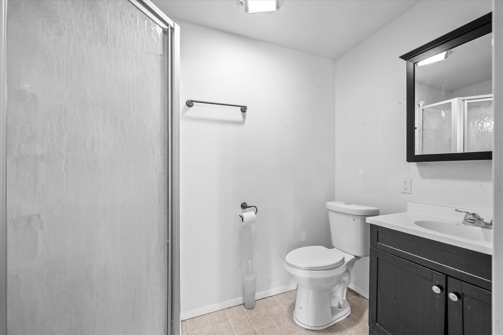 2-s086 2-s086 Harter Road Elburn, IL 60119 - Photo 17 of 34 a bathroom with a toilet a sink and mirror