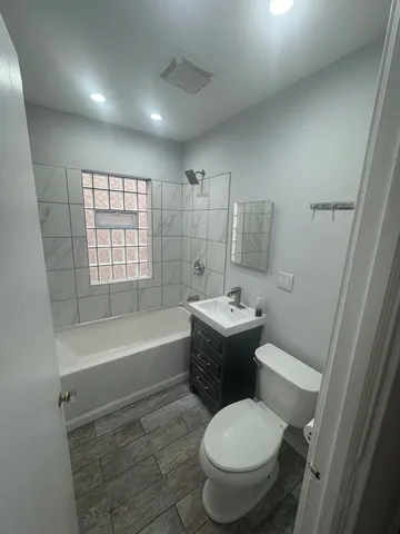 a bathroom with a sink toilet and bathtub