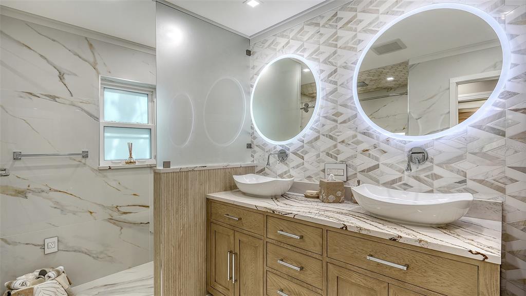 536 Ketch Lane Longboat Key, FL 34228 - Photo 42 of 80 a bathroom with a granite countertop sink and mirror