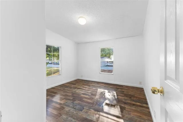 an empty room with windows