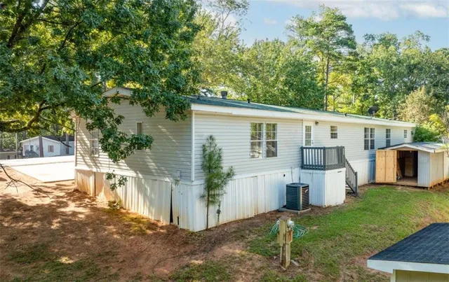 a view of a yard in front view of a house