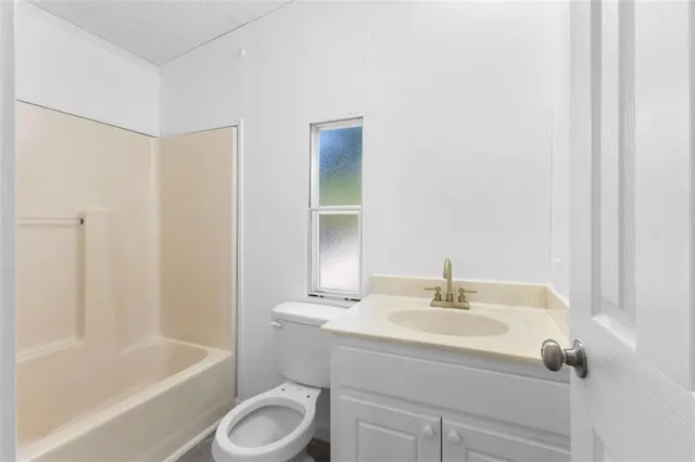 a bathroom with a sink toilet and bathtub