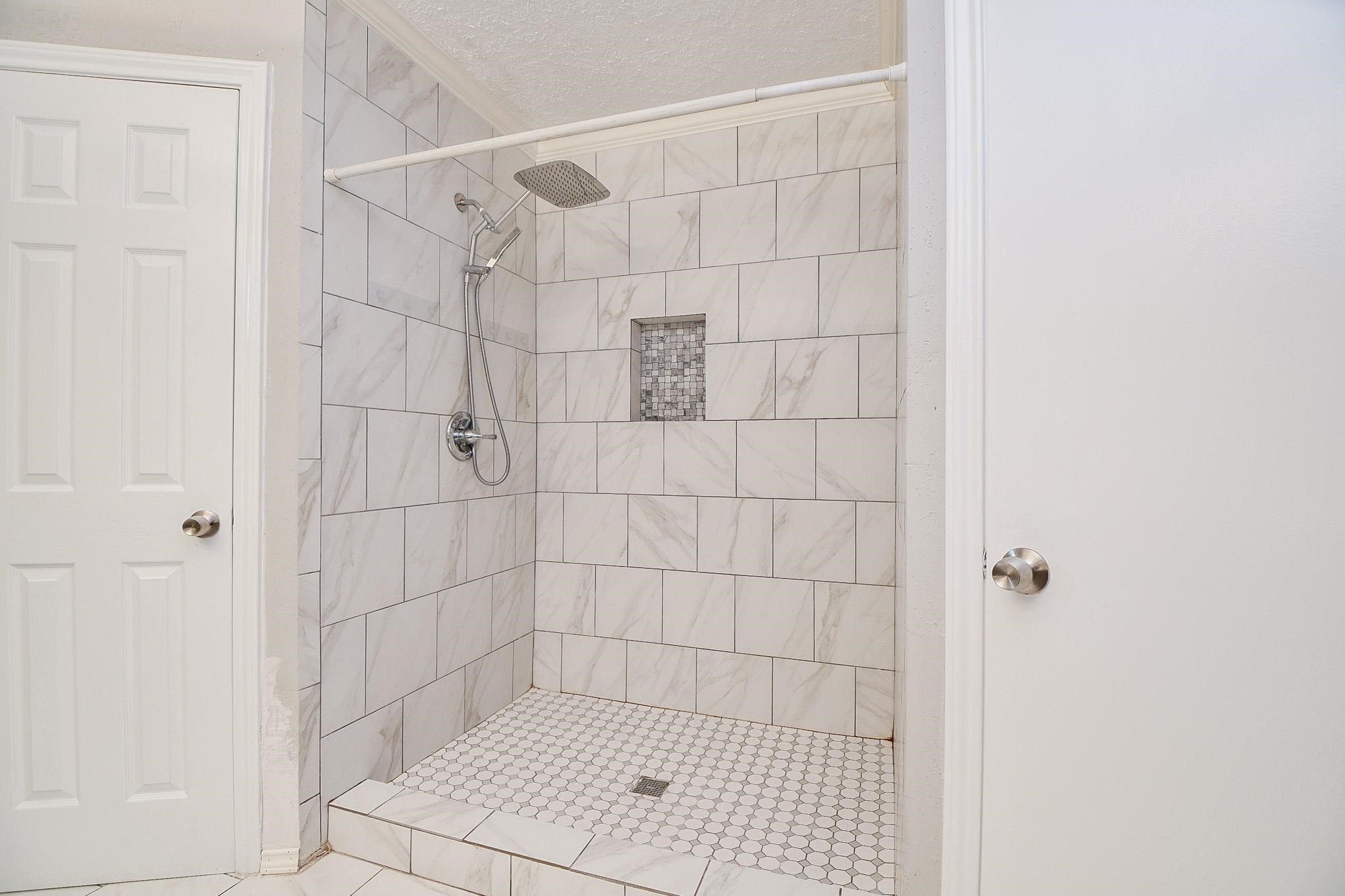 2331 Wren Meadow Road Richmond, TX 77406 - Photo 21 of 37 Enjoy pure luxury in your stunning primary shower space!