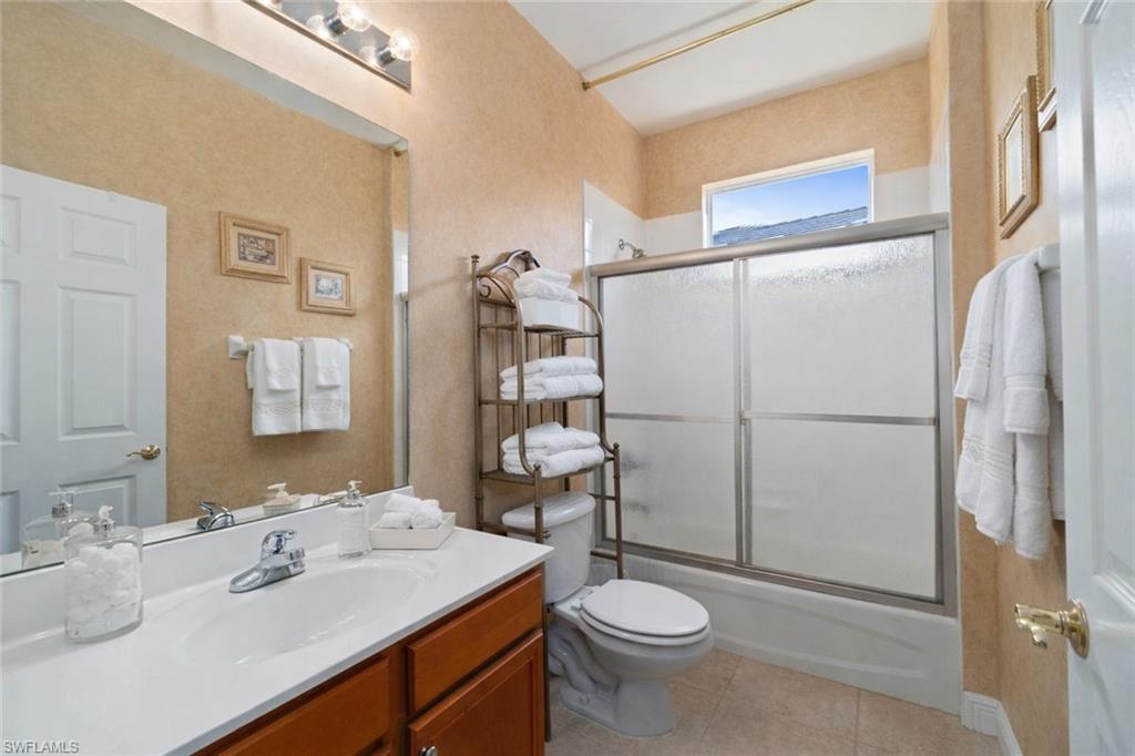 4832 Cerromar Drive Naples, FL 34112 - Photo 15 of 30 a bathroom with a sink toilet and shower