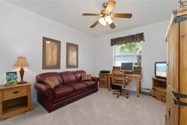 a living room with furniture and a window