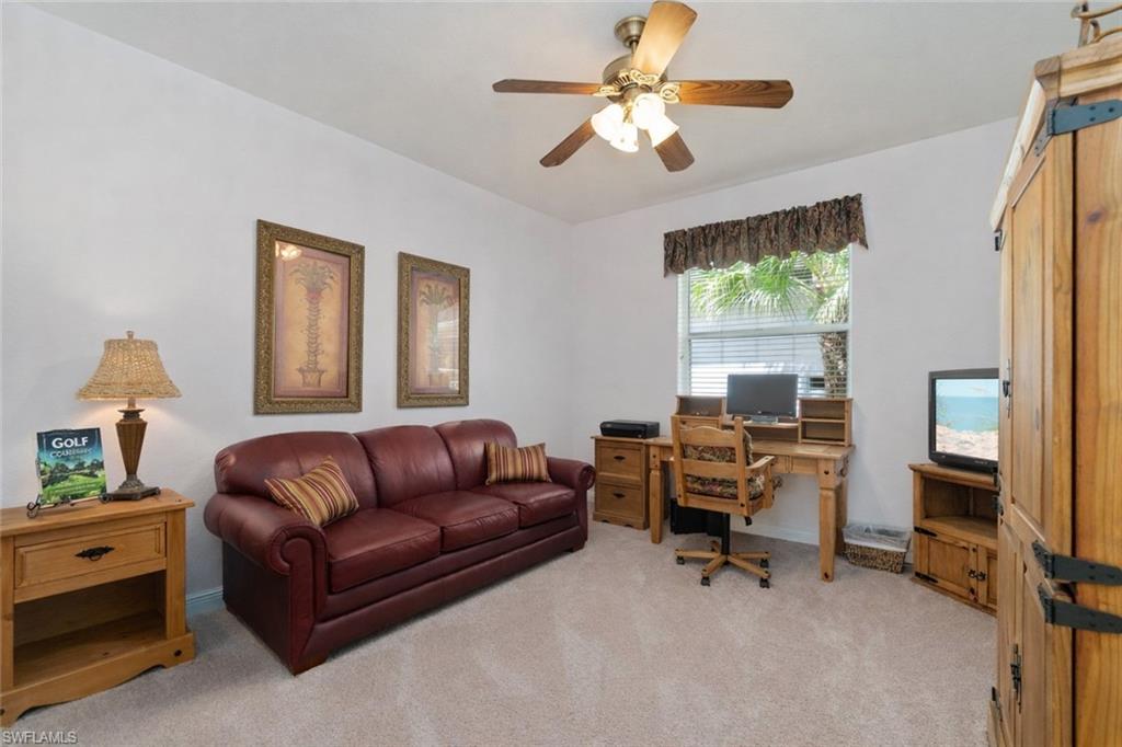 4832 Cerromar Drive Naples, FL 34112 - Photo 16 of 30 a living room with furniture and a window