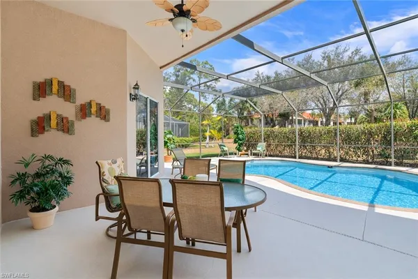 a dining room with a table and chairs