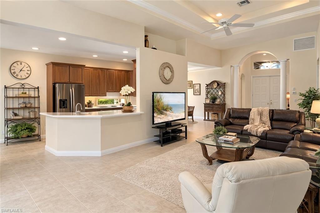 4832 Cerromar Drive Naples, FL 34112 - Photo 2 of 30 a living room with furniture kitchen view and a window