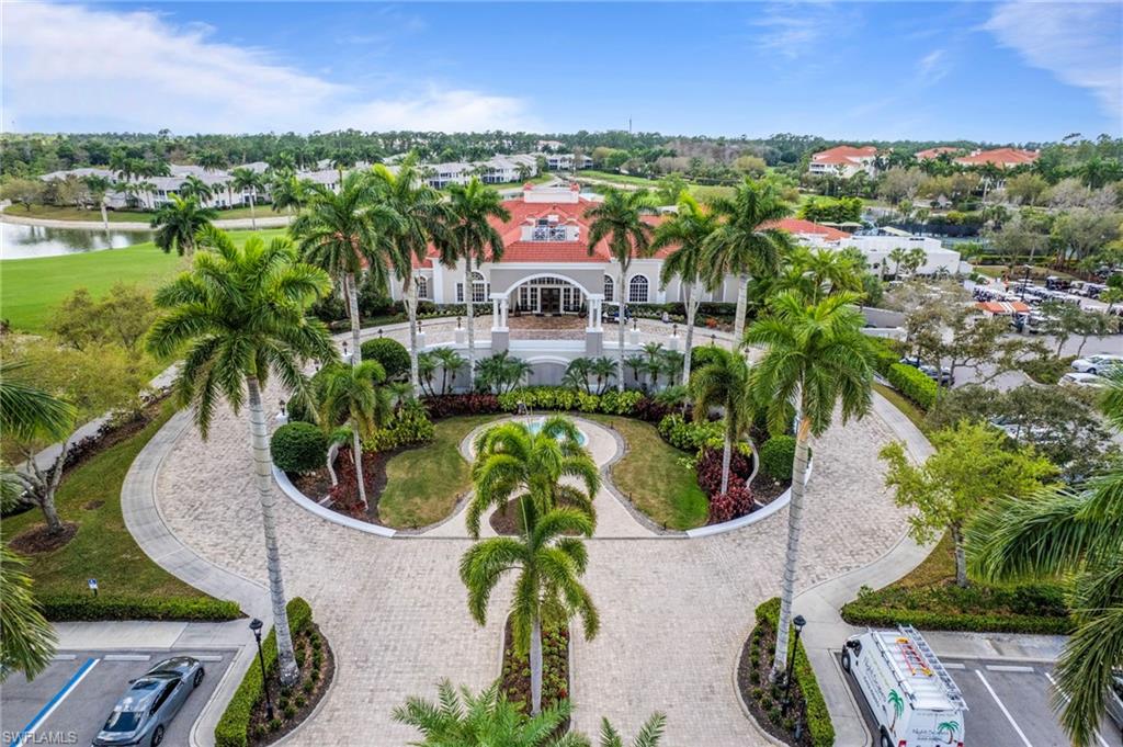 4832 Cerromar Drive Naples, FL 34112 - Photo 30 of 30 an aerial view of a house with a yard and lake view