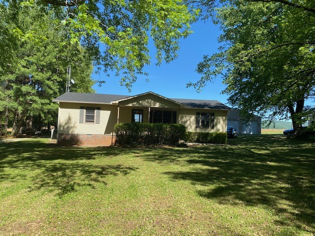 546 Rutledge Ford Road Decherd, TN 37324 - Photo 1 of 26 a front view of a house with a garden