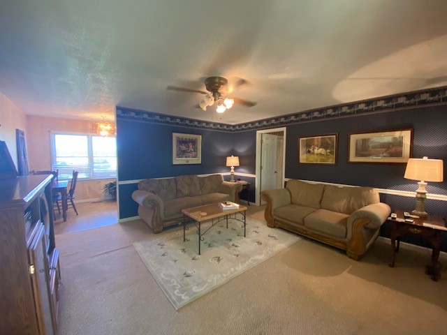 546 Rutledge Ford Road Decherd, TN 37324 - Photo 14 of 26 a living room with furniture and a chandelier