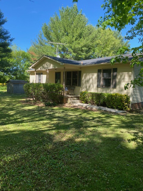 546 Rutledge Ford Road Decherd, TN 37324 - Photo 3 of 26 a front view of a house with a garden