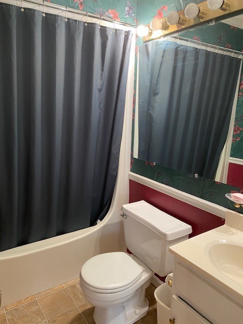 546 Rutledge Ford Road Decherd, TN 37324 - Photo 25 of 26 a bathroom with a toilet and a shower curtain