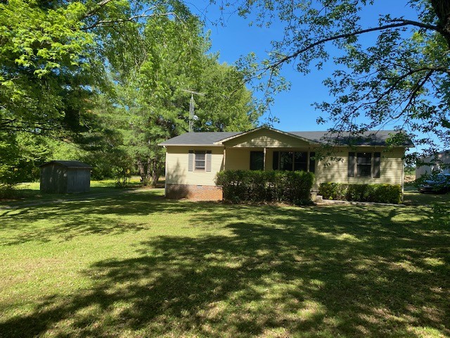 546 Rutledge Ford Road Decherd, TN 37324 - Photo 4 of 26 a front view of a house with a yard