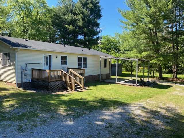 546 Rutledge Ford Road Decherd, TN 37324 - Photo 10 of 26 a view of a house with backyard porch and sitting area